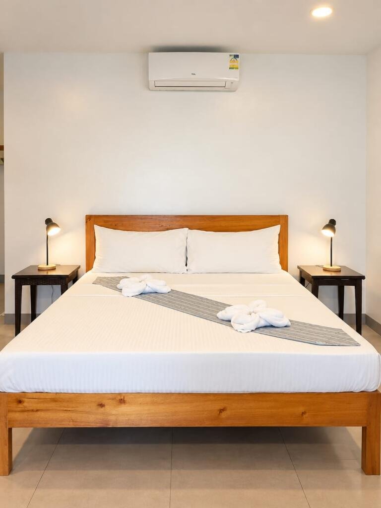 Duplex Deluxe Villa Seaview bedroom with hardwood king bed, Sunset Cove Resort Romblon